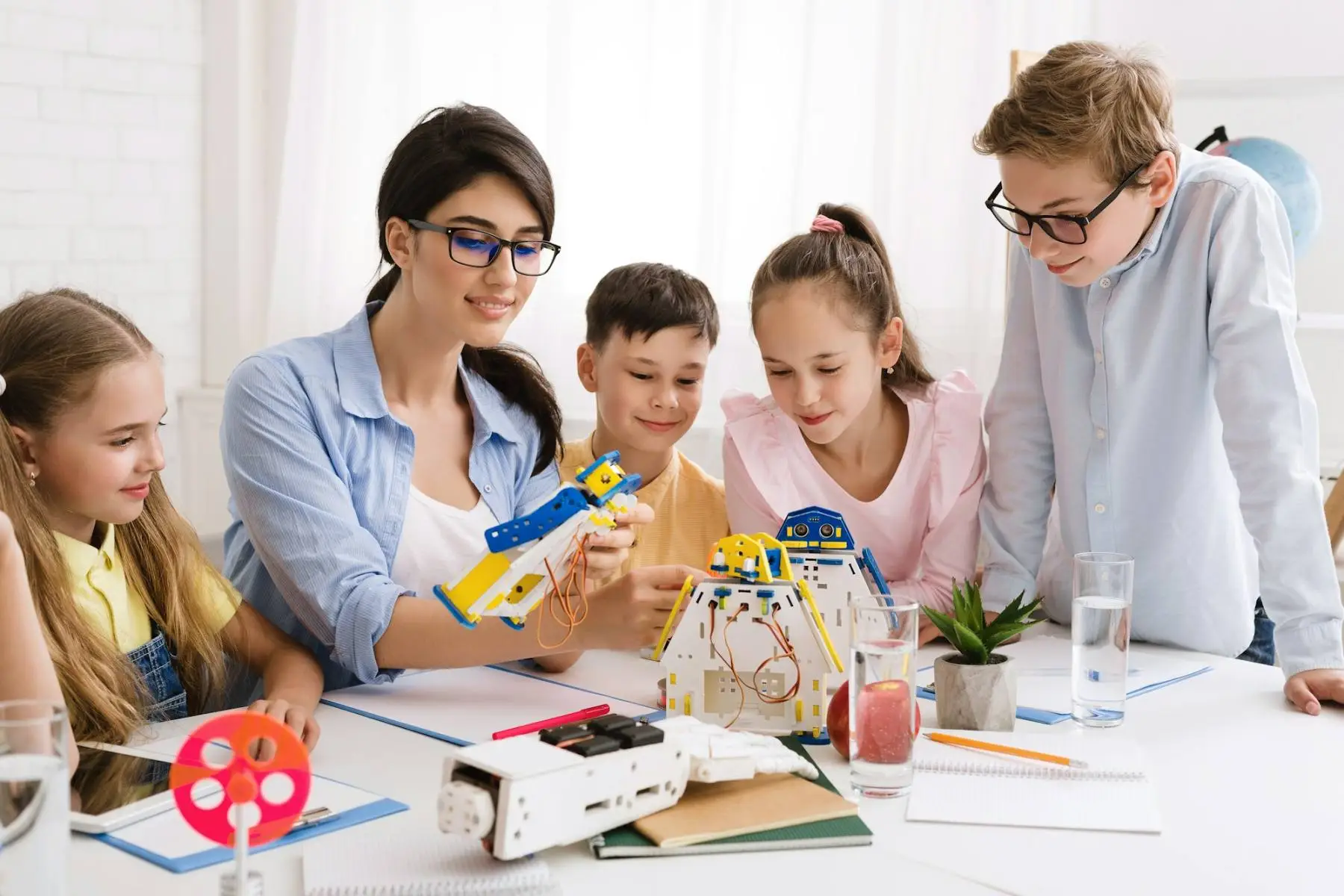 Students building robots in a classroom